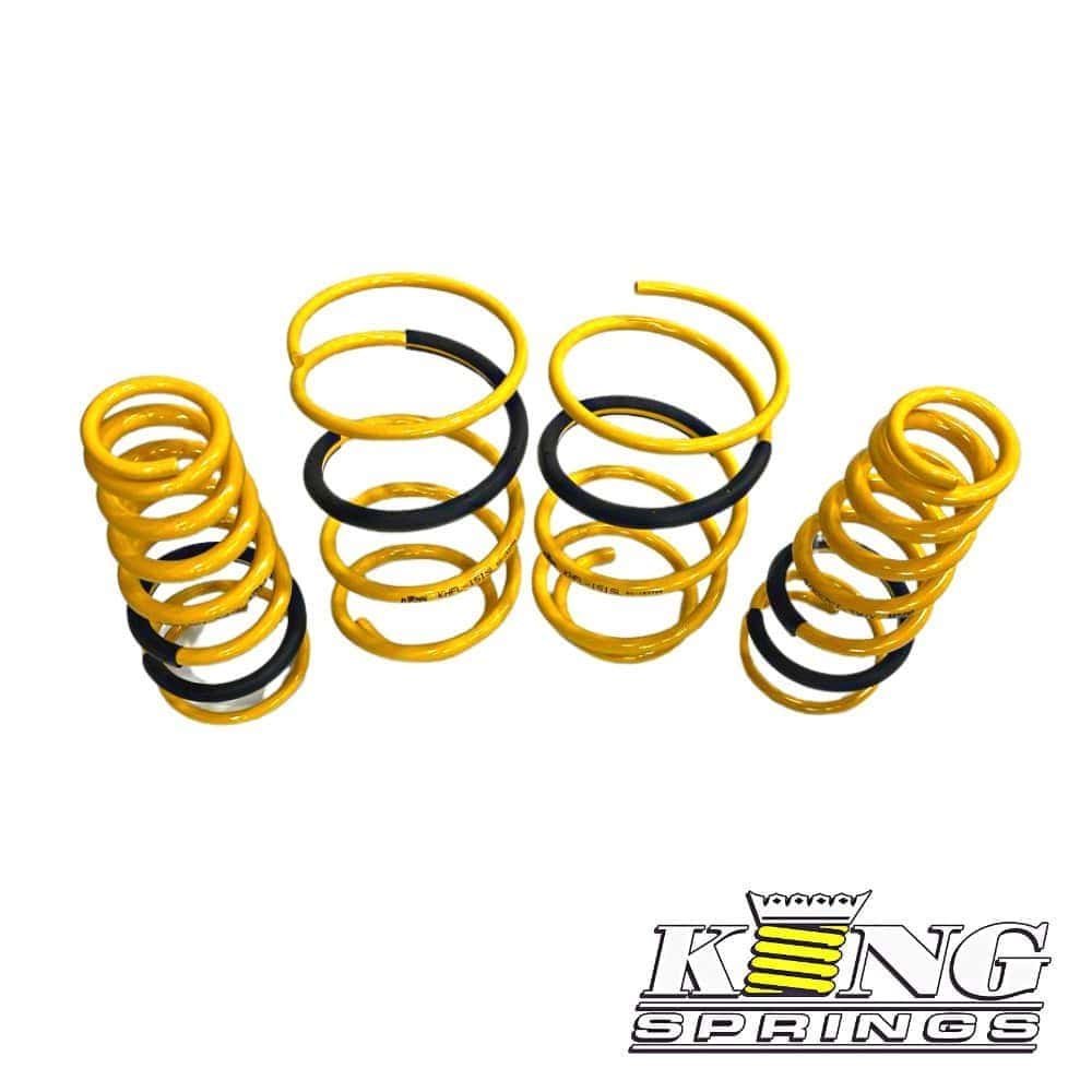 Heavy-duty yellow and black coil springs for automotive suspension systems.