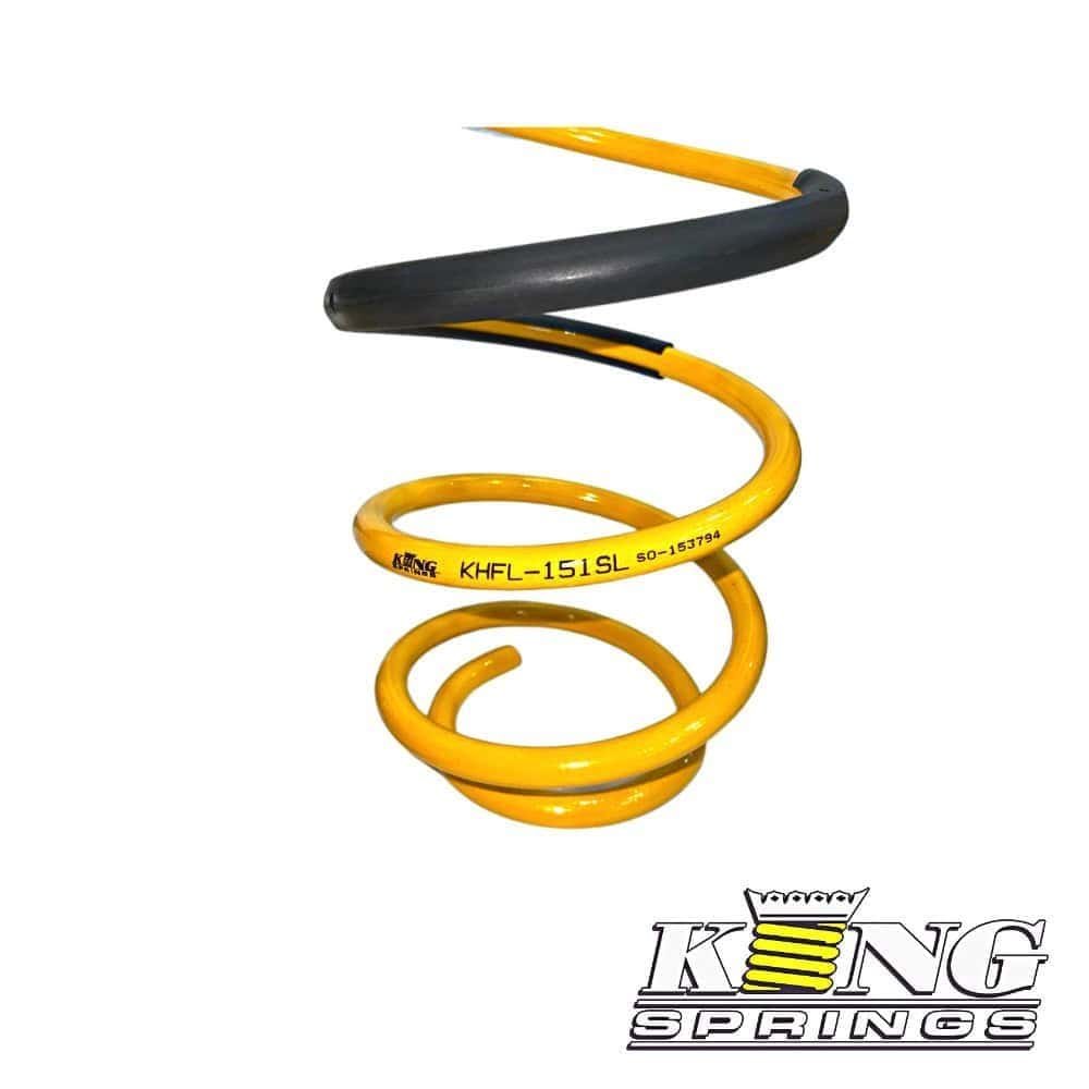 Heavy-duty yellow and black coil spring for industrial machinery.