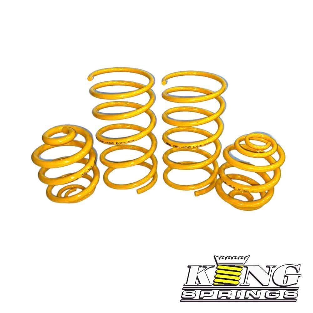 Yellow coil springs for automotive suspension, high-quality King Springs from Al Shiba General Tradi.