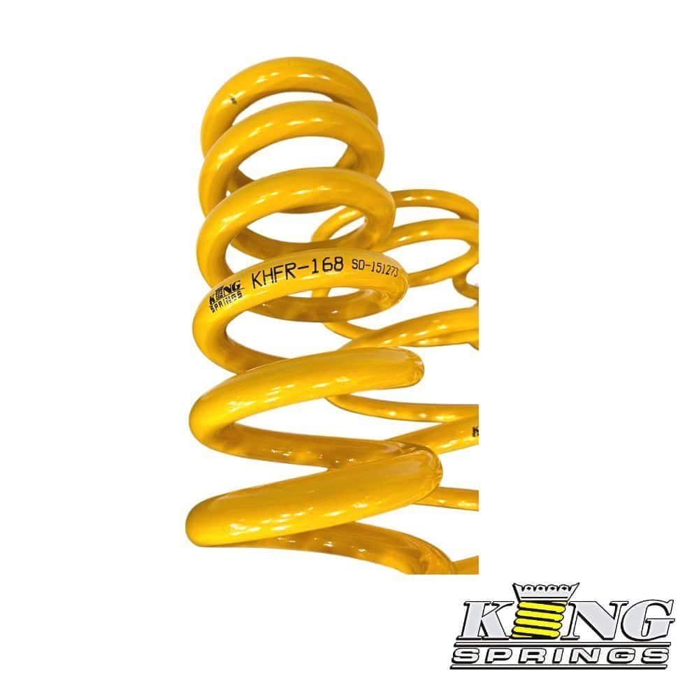High-quality yellow coil spring for industrial and automotive applications.