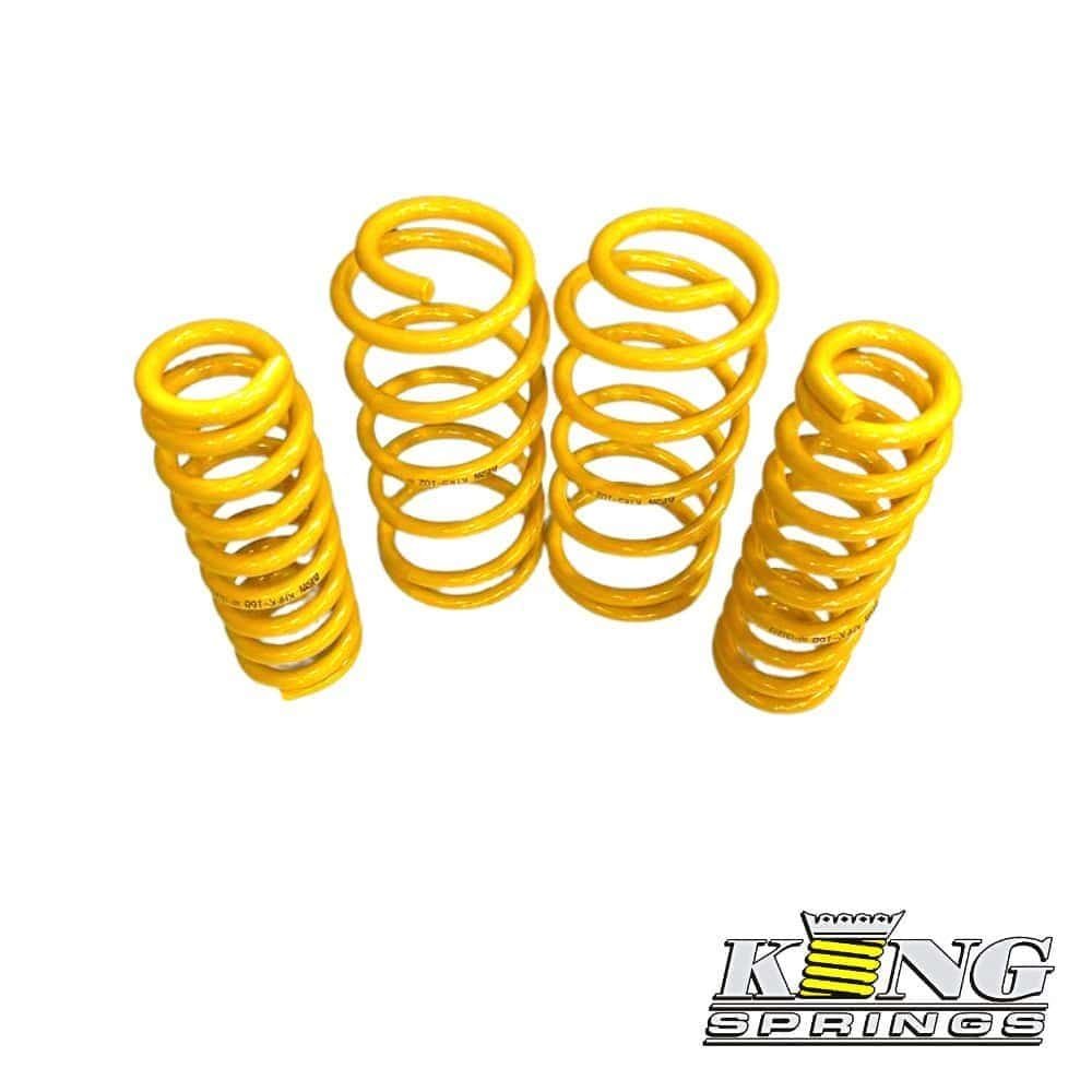 Yellow coil springs for automotive suspension, high-quality and durable.
