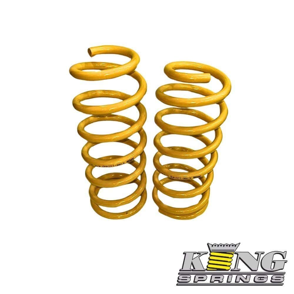 Heavy-duty yellow coil springs for industrial or automotive use.