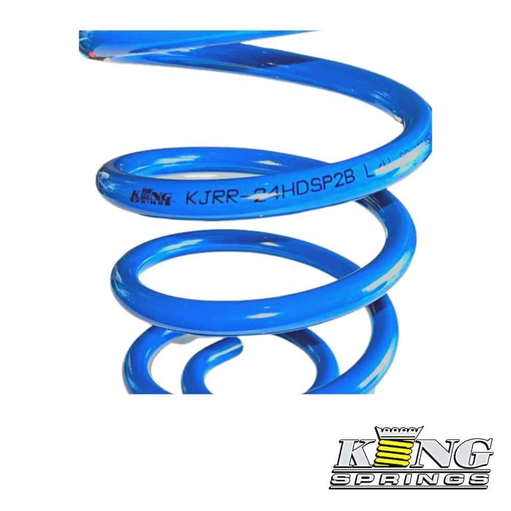 Blue coil spring for industrial or automotive use, manufactured by King Springs.