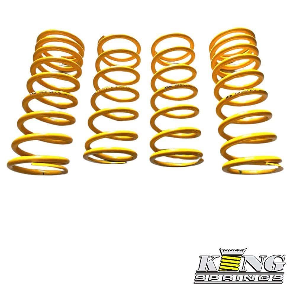 Coil springs for automotive suspension in yellow color.