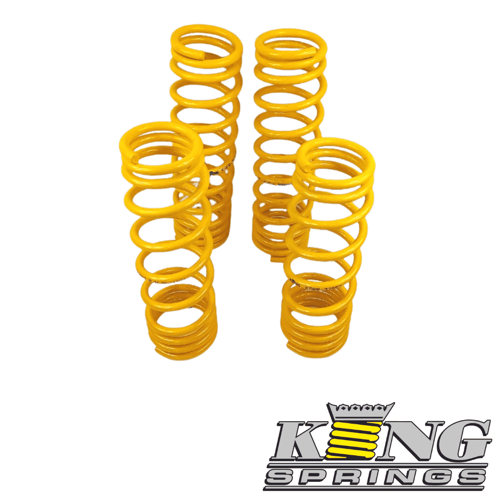 Yellow coil springs for industrial or automotive use, arranged vertically.