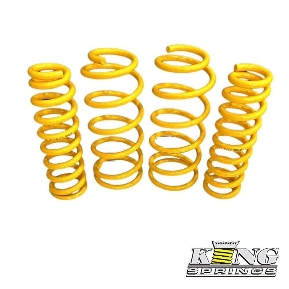 Yellow coil springs for automotive suspension, high-quality shock absorber components.