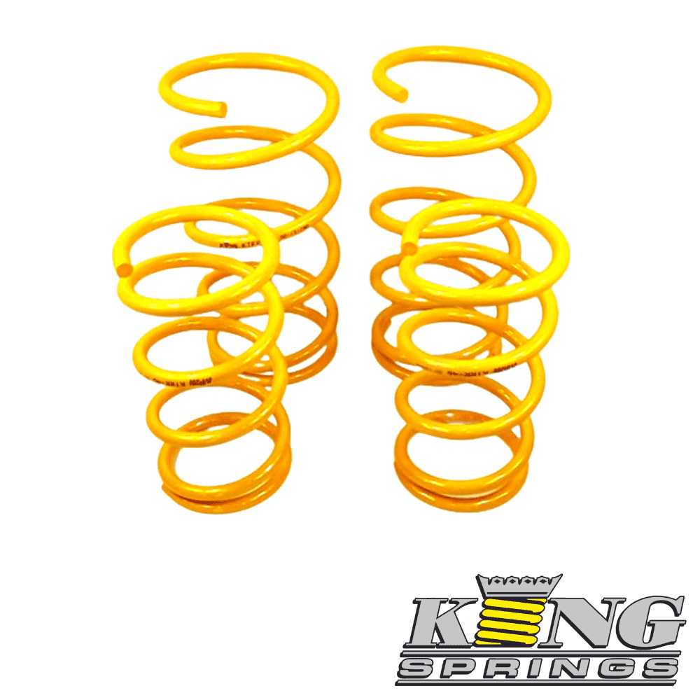 Yellow coil springs for automotive suspension, high-quality and durable.