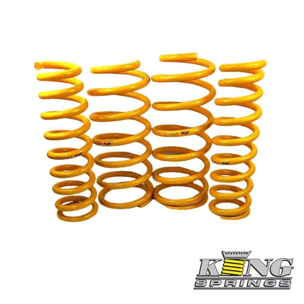 Yellow coil springs for automotive suspension, high-quality and durable.