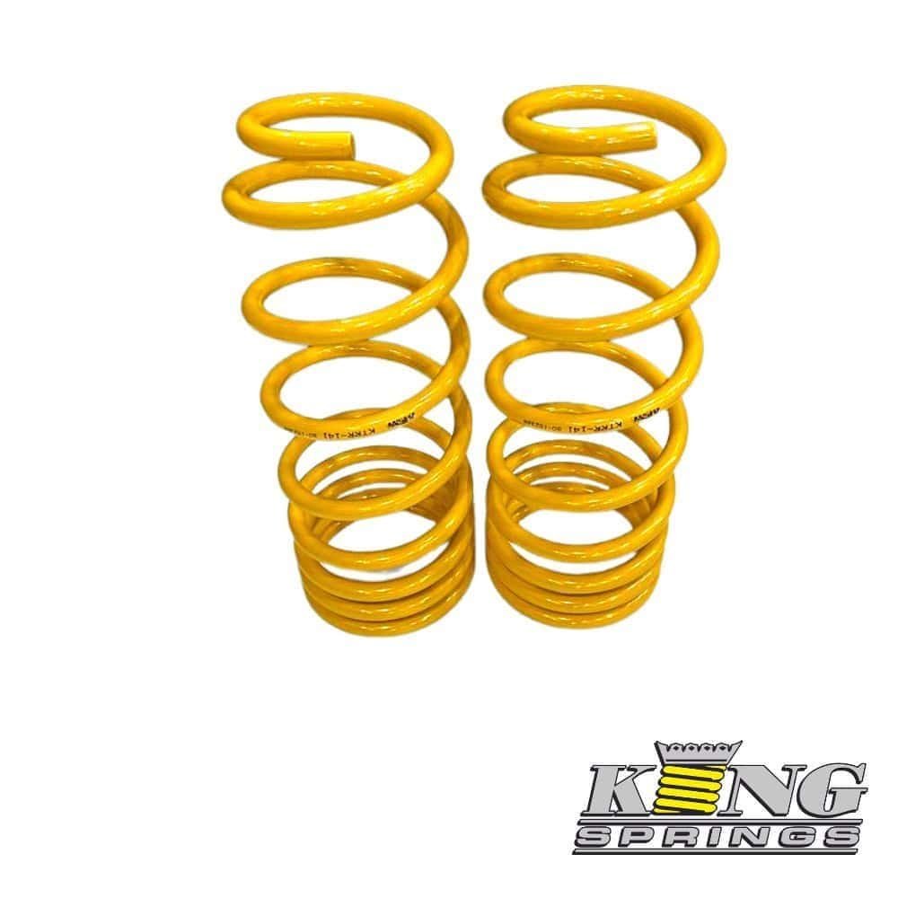 Yellow coil springs for automotive suspension from Al Shiba General Trading.