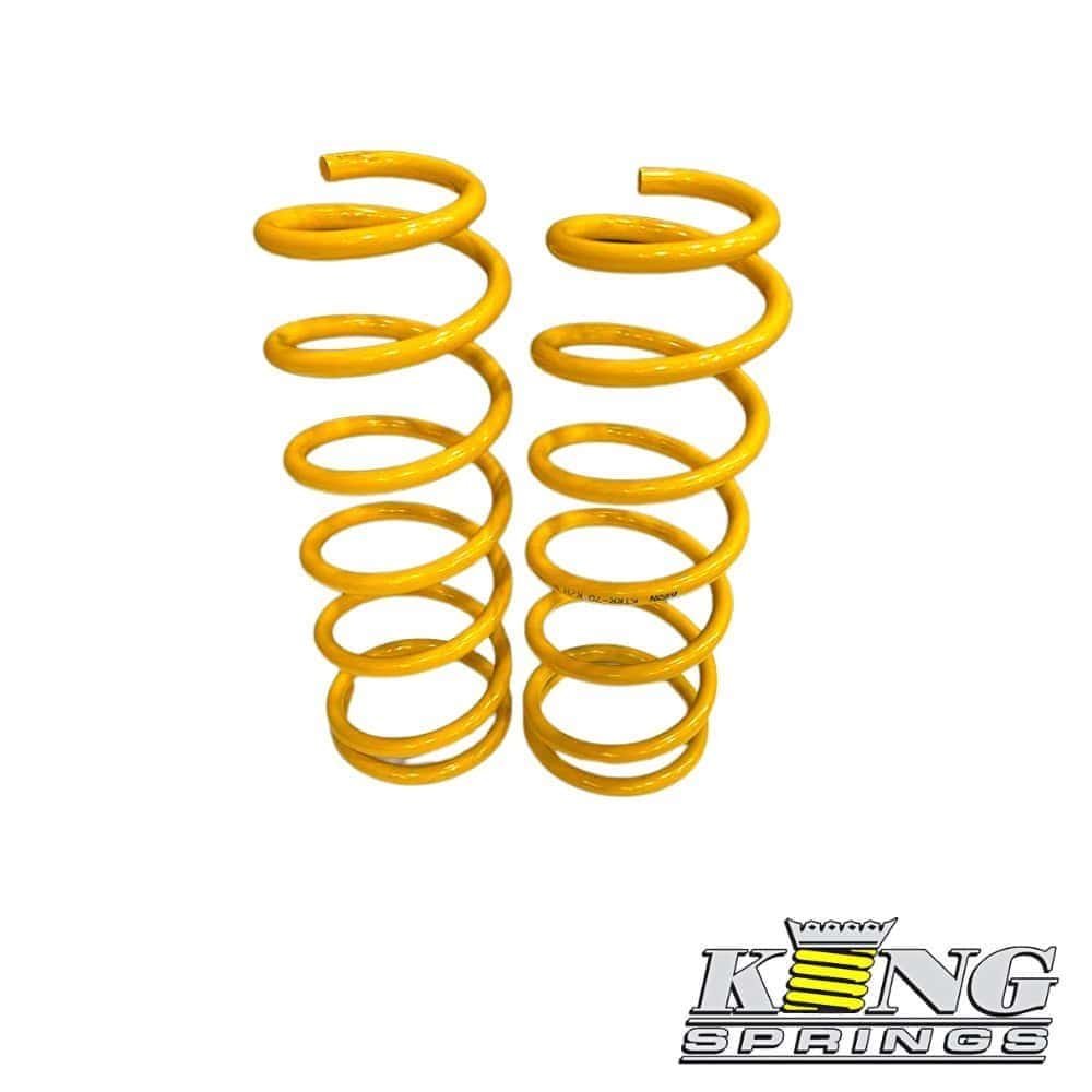 Yellow coil springs for industrial or automotive use, showcasing durability and high-quality materia.