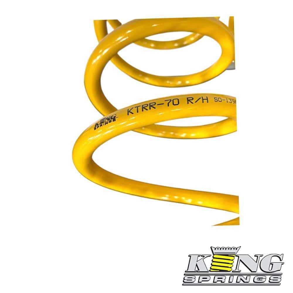 High-quality yellow coil spring for industrial machinery and automotive applications.