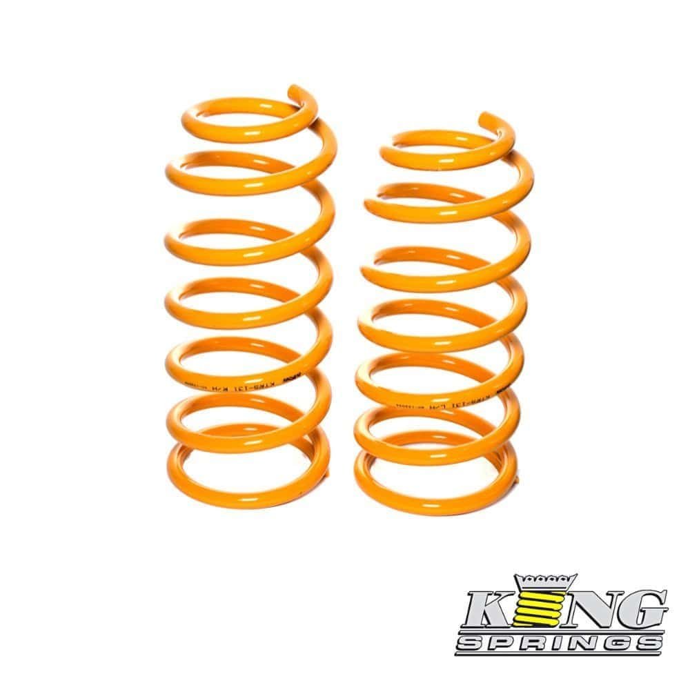 High-quality orange coil springs for automotive suspension systems.