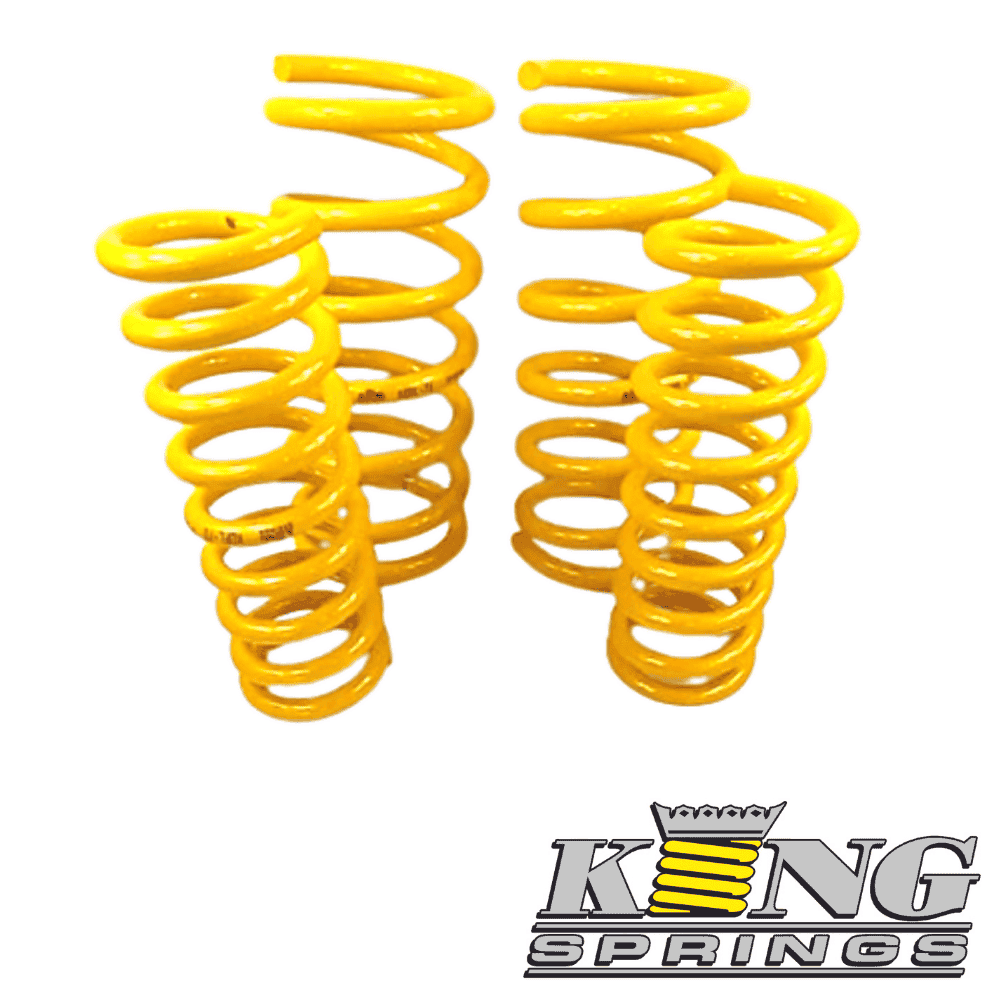 Yellow coil springs for automotive suspension, high-quality shock absorbers.