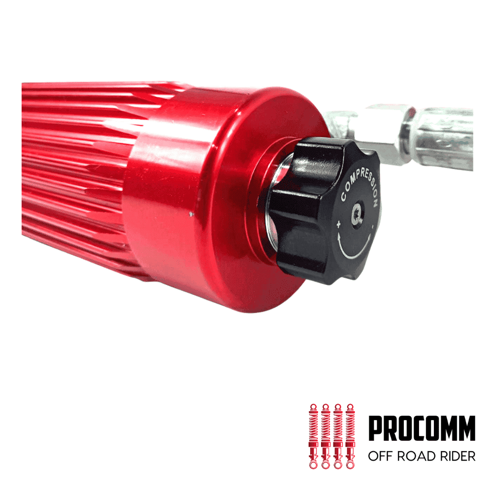Red off-road shock absorber for vehicles, high-performance suspension component.