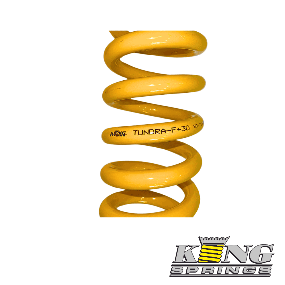 Tundra F+30 yellow coil spring for vehicle suspension, high-performance automotive part.