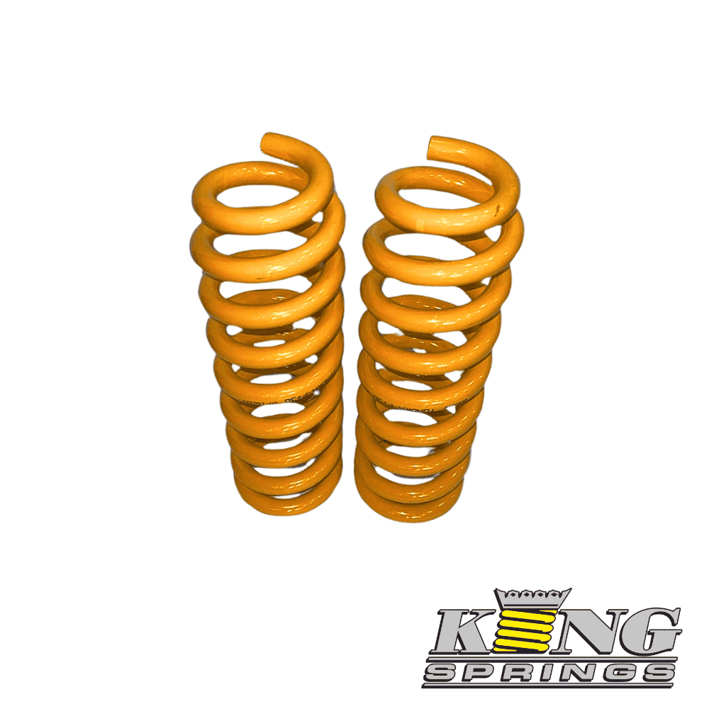 Heavy-duty orange coil springs for industrial machinery and automotive use.