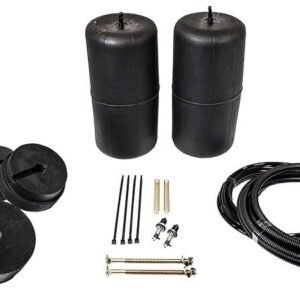Heavy-duty black rubber bumpers and flexible conduit for industrial piping and equipment protection.