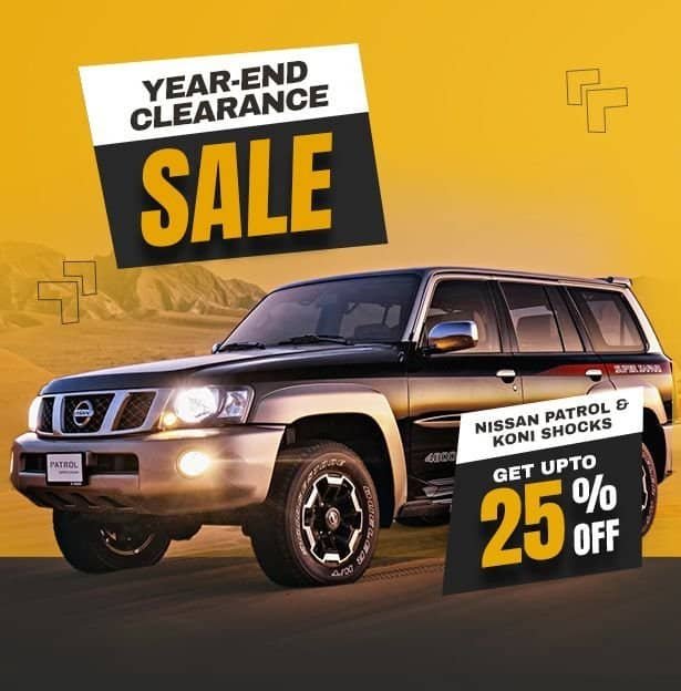 All-Black Nissan Patrol SUV on desert road during sunset, promoting year-end clearance sale with up.