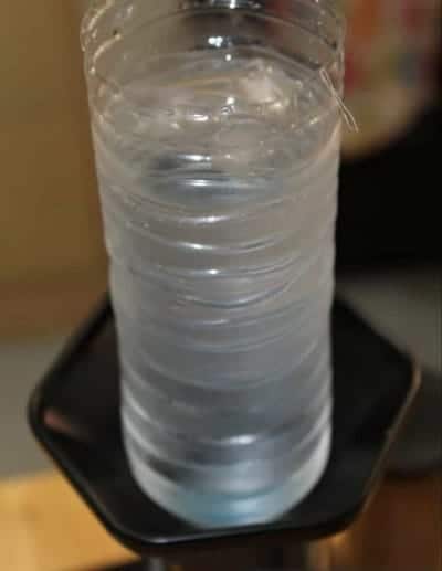 Water bottle placed on top of aeropress