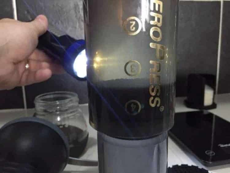 Aeropress showing coffee inside 