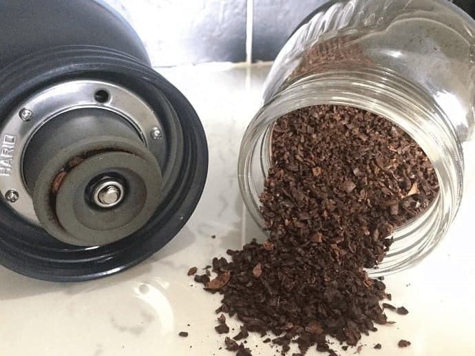 Coarsely ground coffee in a glass jar 