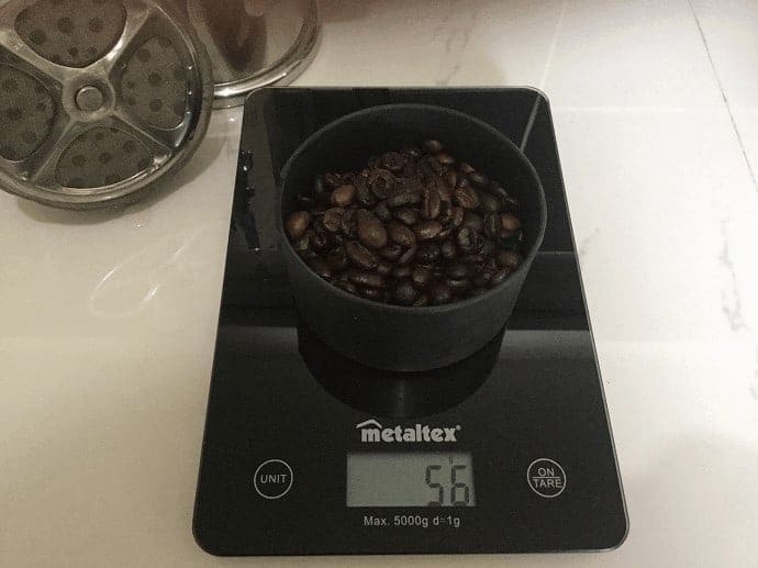 Coffee being weighed on a scale 