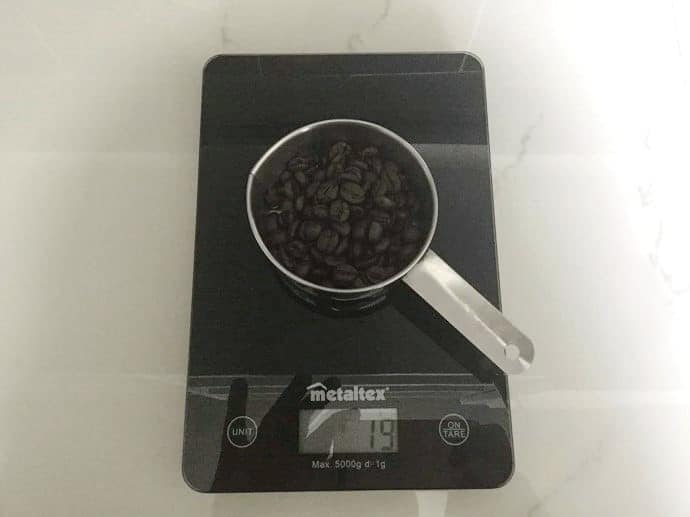 Coffee being weighed on a scale 