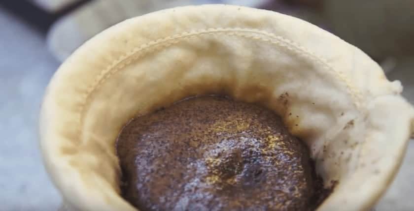 coffee blooming in a cloth sock filter 