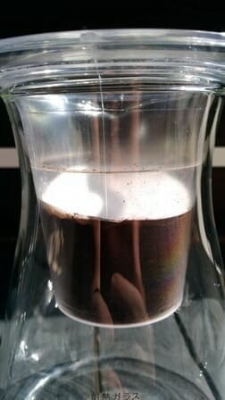 Aeropress paper filter placed on top of the ground coffee