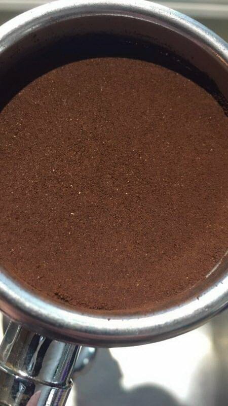 espresso filter basket with leveler tool