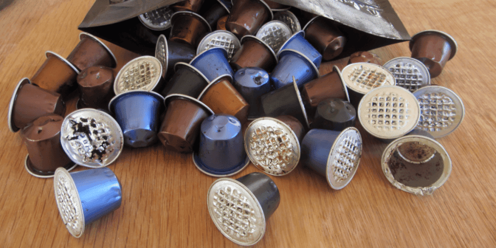 Old Nespresso coffee pods in a pile