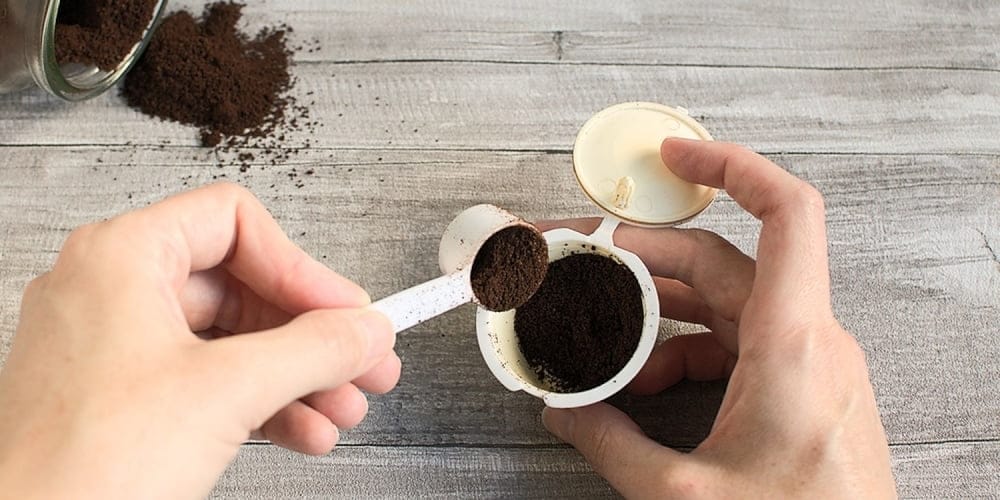 Filling a Nespresso pod with my ground coffee