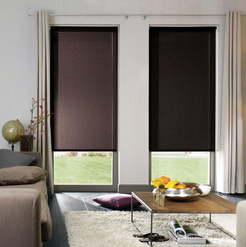 Stylish blackout roller shades for modern living room windows.