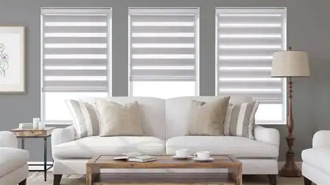 Bright living room with stylish zebra roller blinds and natural light control.