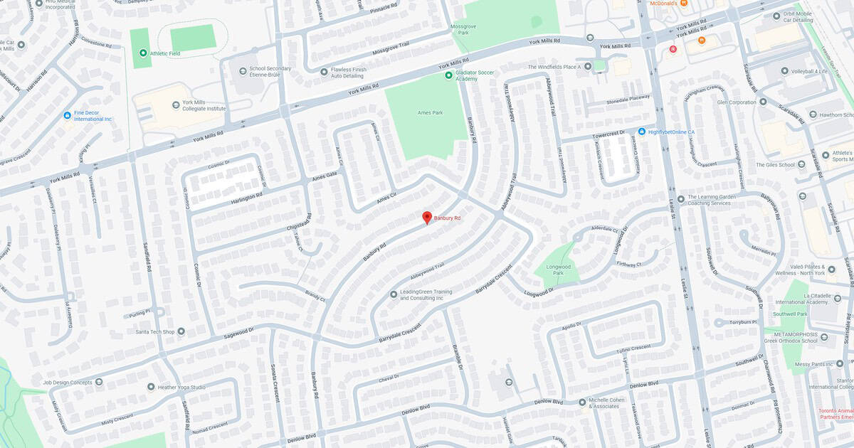 Map of residential neighborhood with streets and green spaces.