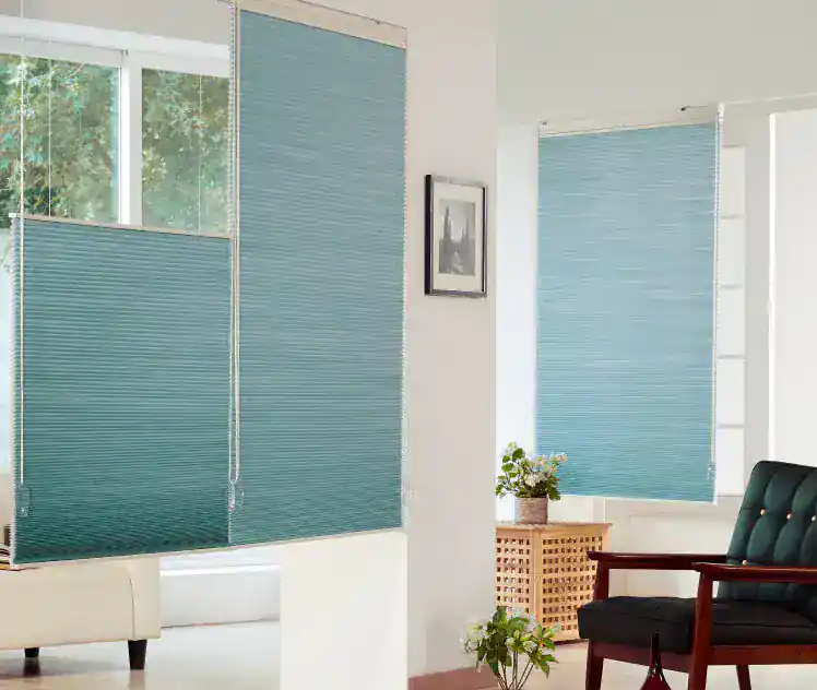 Blue window blinds in a bright, modern living room with natural light and stylish decor.
