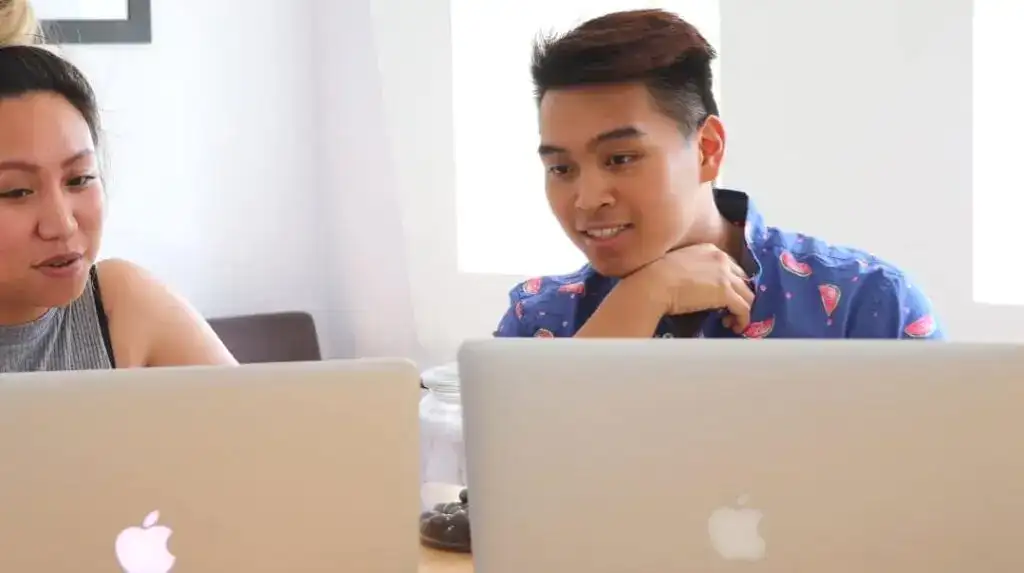 Young professionals collaborating on a project at a modern office.