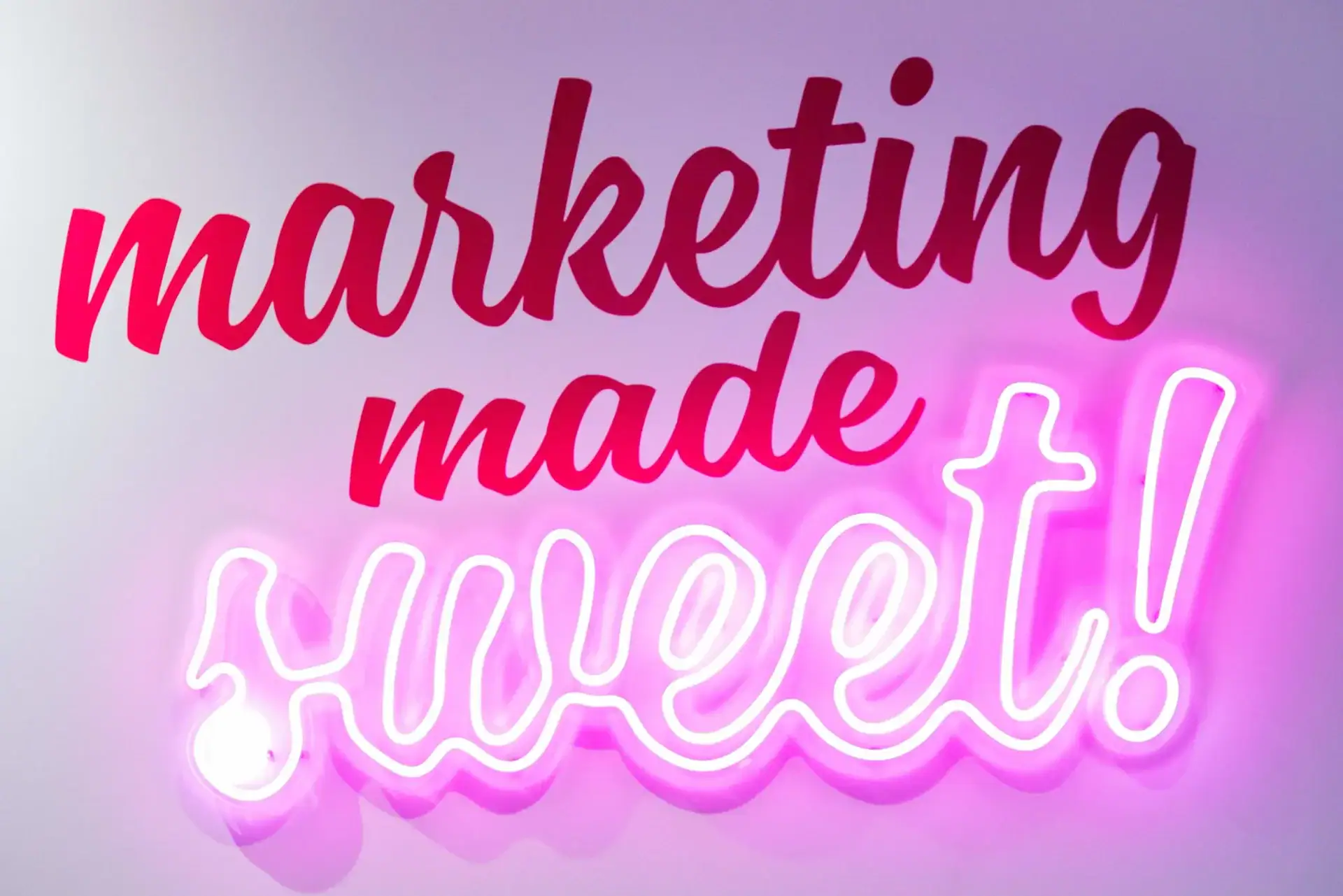 Bright neon sign reading "marketing made honest" for digital marketing branding.