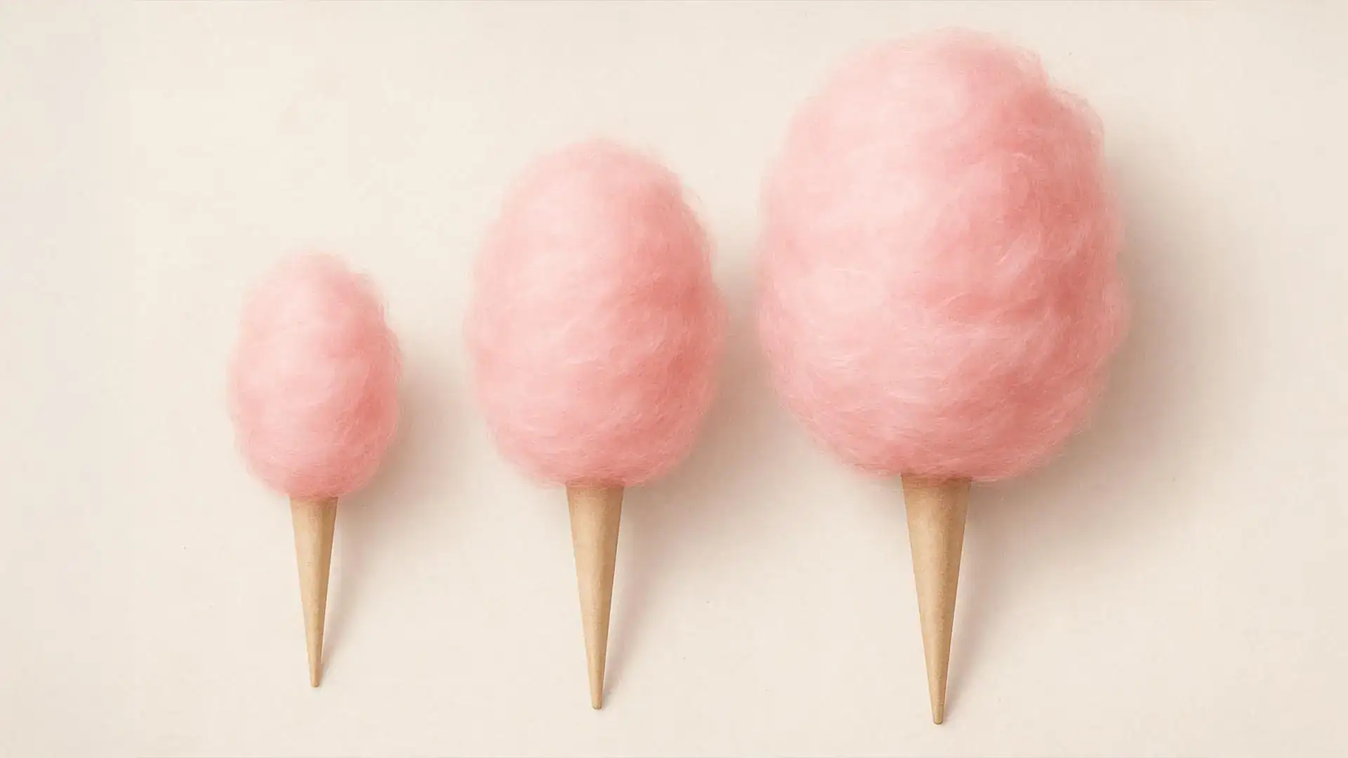 Three pink cotton candy cones representing growth and success in marketing.