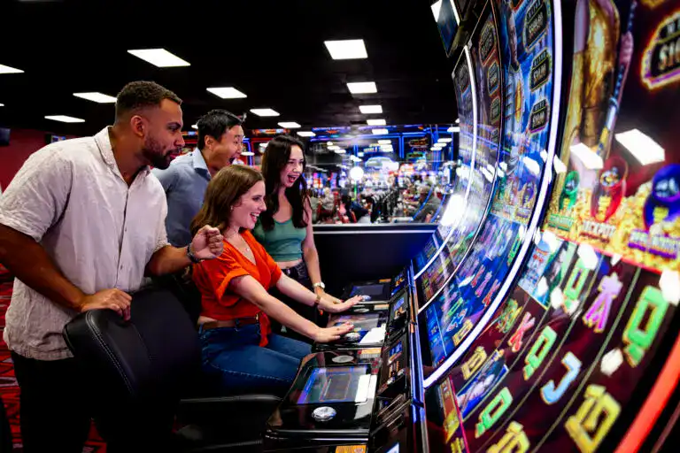 People playing slot machines at Delta Bingo casino.