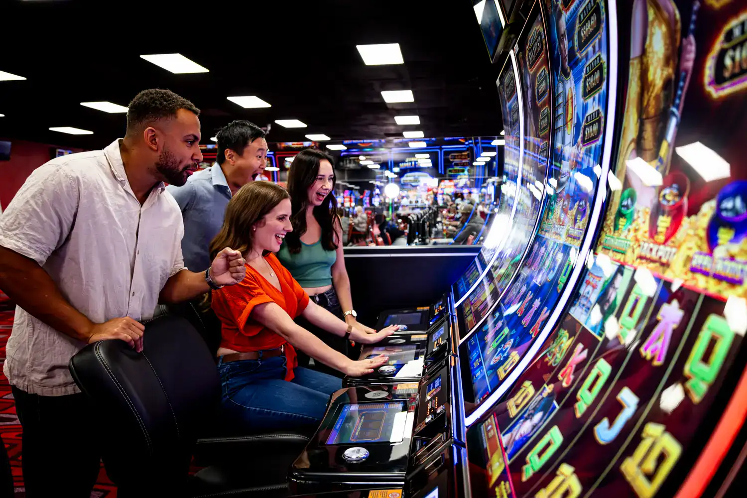 People playing slot machines at Delta Bingo casino.
