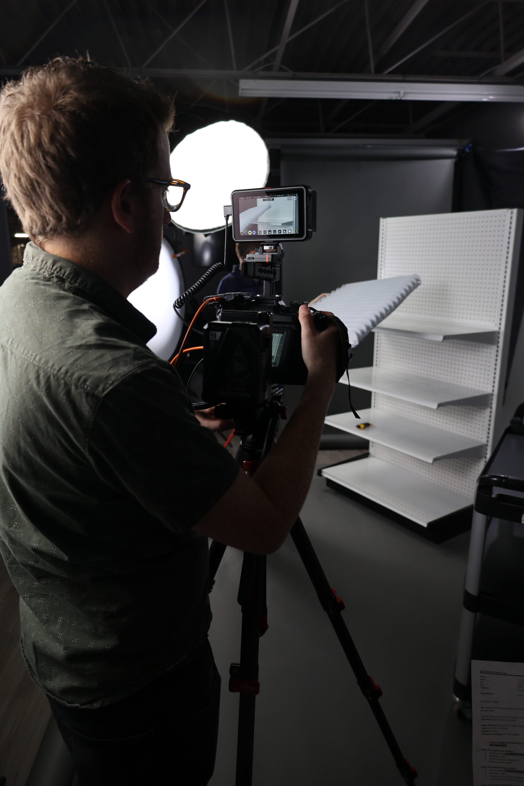 Professional photographer capturing product setup for measurement and reporting visuals.