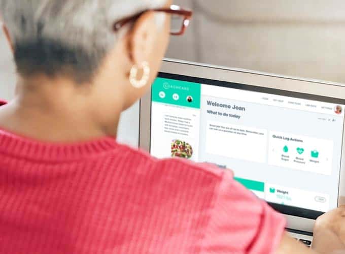 Patient looking at the coachcare dashboard on a laptop