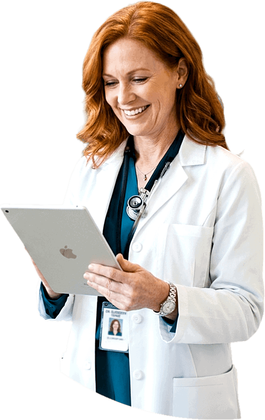 Cheerful female doctor holding a tablet, looking at the screen and smiling
