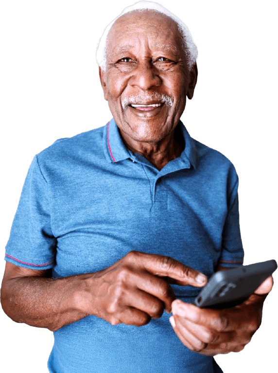 Elderly man using smartphone at home looking at camera