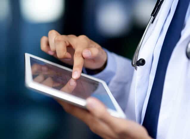 Cropped shot of a doctor using a digital tablet in a hospital