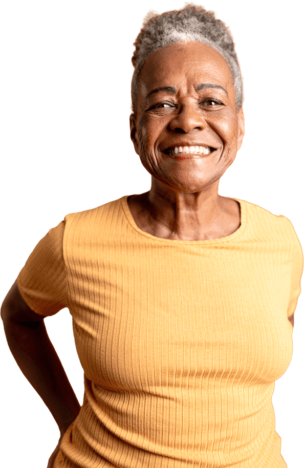 Smiling portrait of a senior African American woman with a yellow shirt on