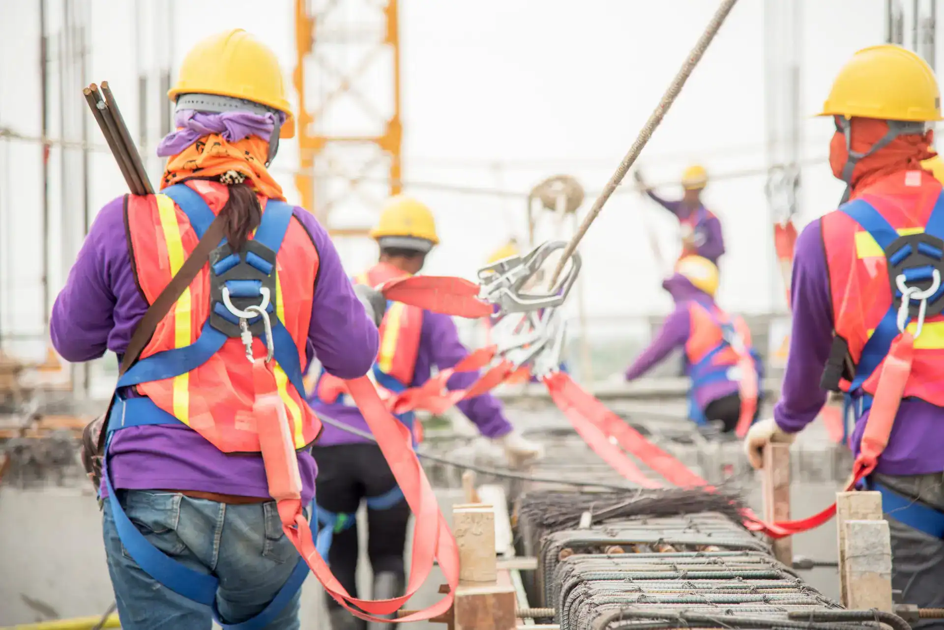 Construction safety and teamwork at a busy construction site.