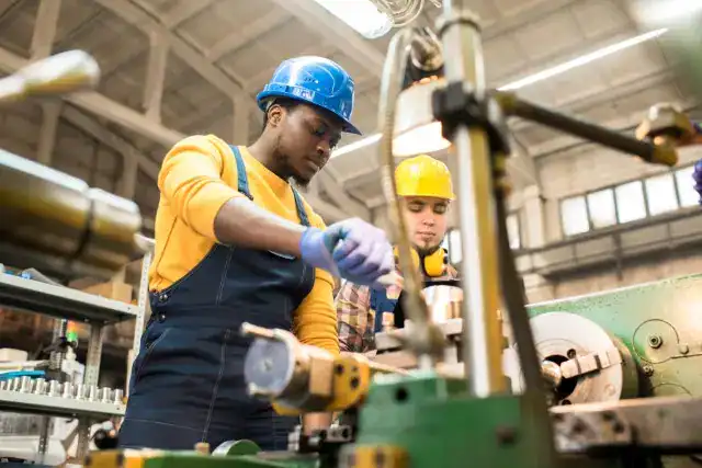 High school students engaged in manufacturing training at CoreCentive.