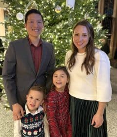 Dr. Chang Dentist Family photo Family celebrating Christmas in front of a decorated tree at Corpus Christi Family Dentistry.